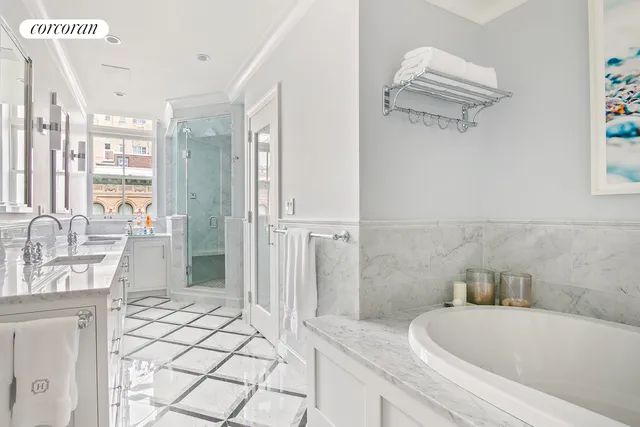a bathroom with a granite countertop sink a toilet a mirror and shower