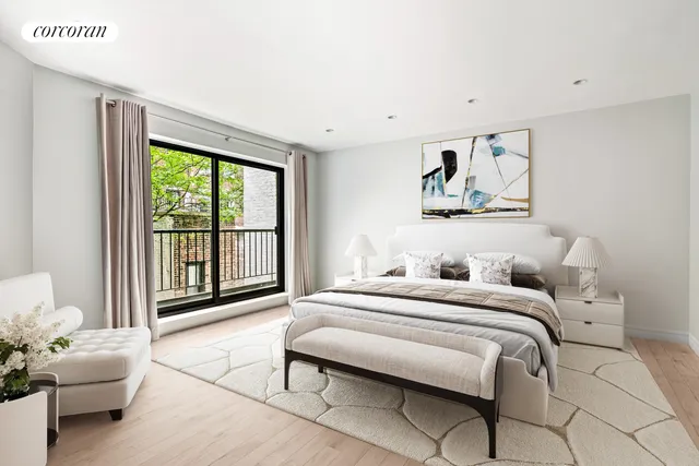 a bedroom with a bed and glass window