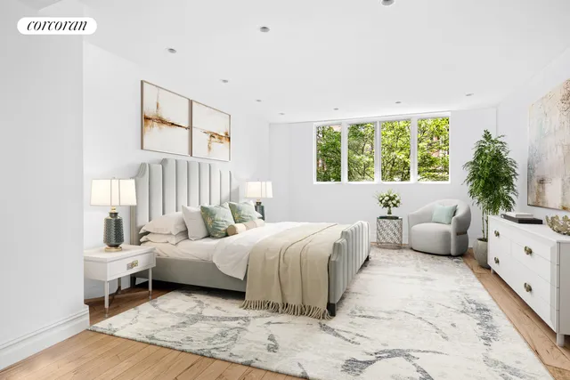 a bedroom with a bed and a couch