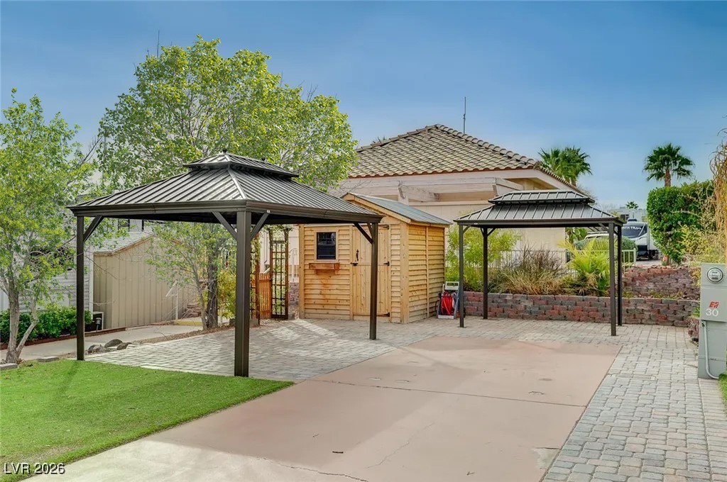 866 Sparrow Way Boulder City, NV 89005 - Photo 12 of 25 View of patio / terrace featuring a gazebo and a shed