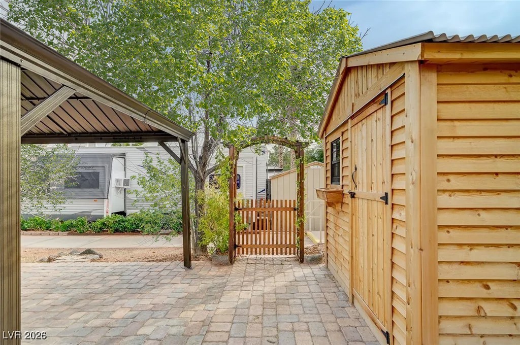 866 Sparrow Way Boulder City, NV 89005 - Photo 18 of 25 View of patio / terrace featuring a shed