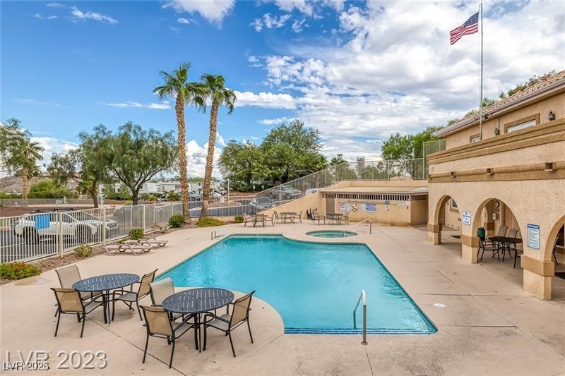 866 Sparrow Way Boulder City, NV 89005 - Photo 6 of 25 Community pool with a patio area and a community hot tub