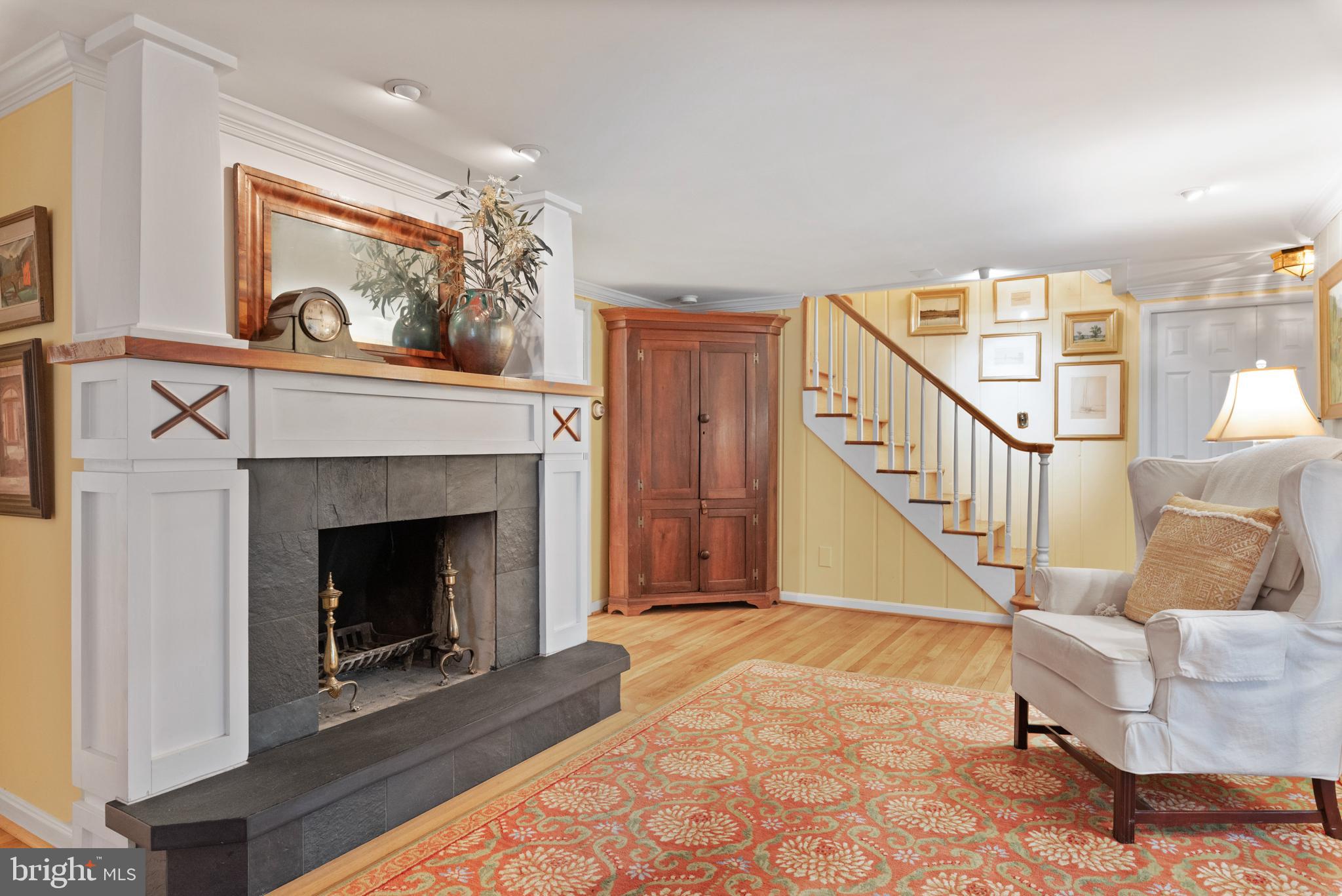 1858 Burley Road Annapolis, MD 21409 - Photo 26 of 76 Family room, fireplace and stairs to upper level.