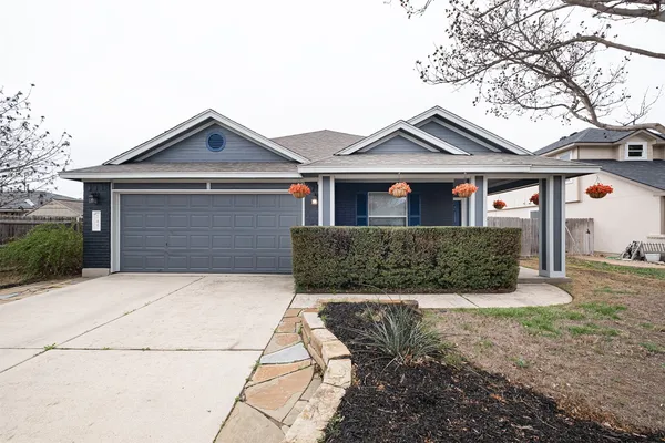 a front view of a house with yard
