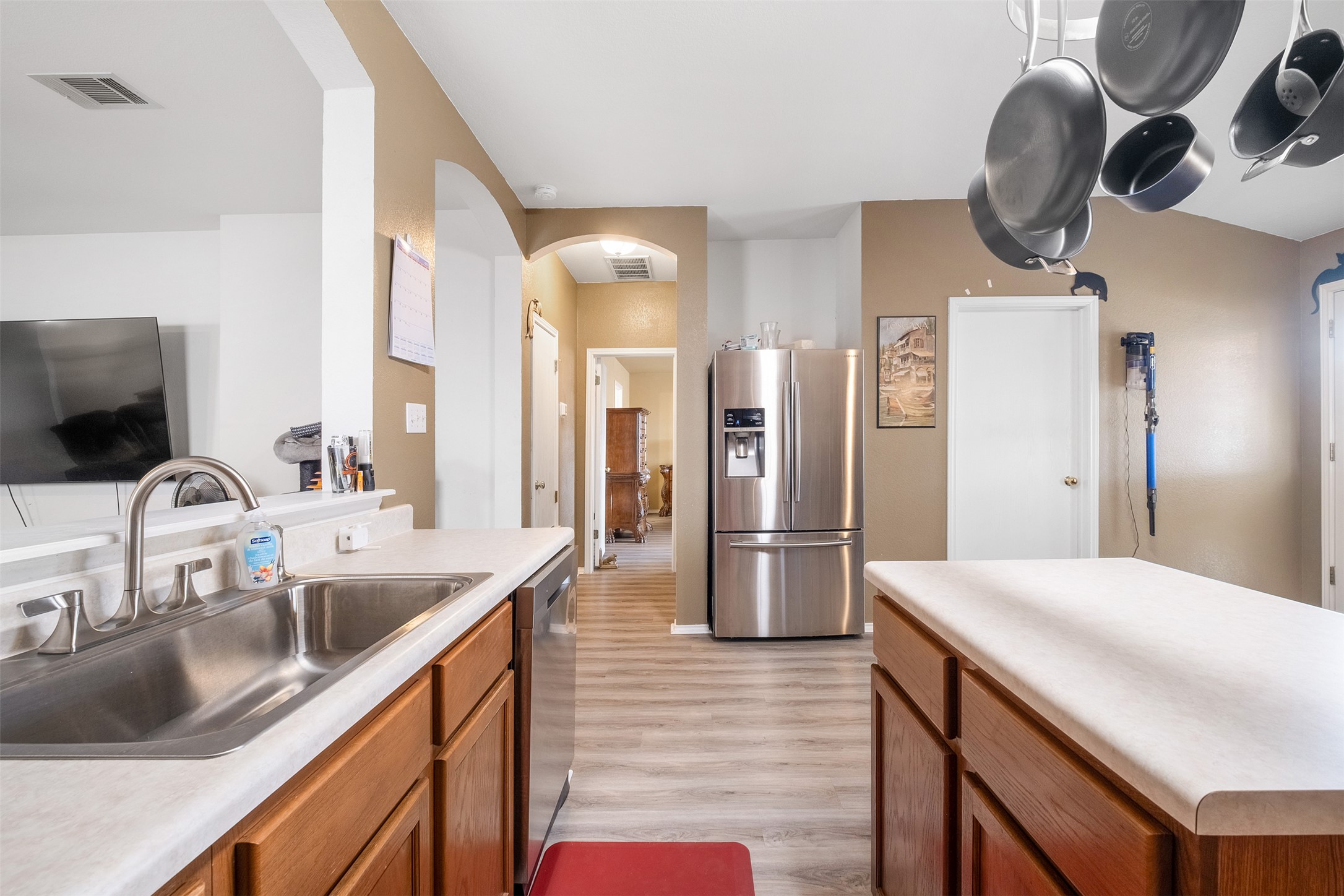 745 Caylor Cove Bastrop, TX 78602 - Photo 12 of 38 a kitchen with stainless steel appliances a sink stove and refrigerator