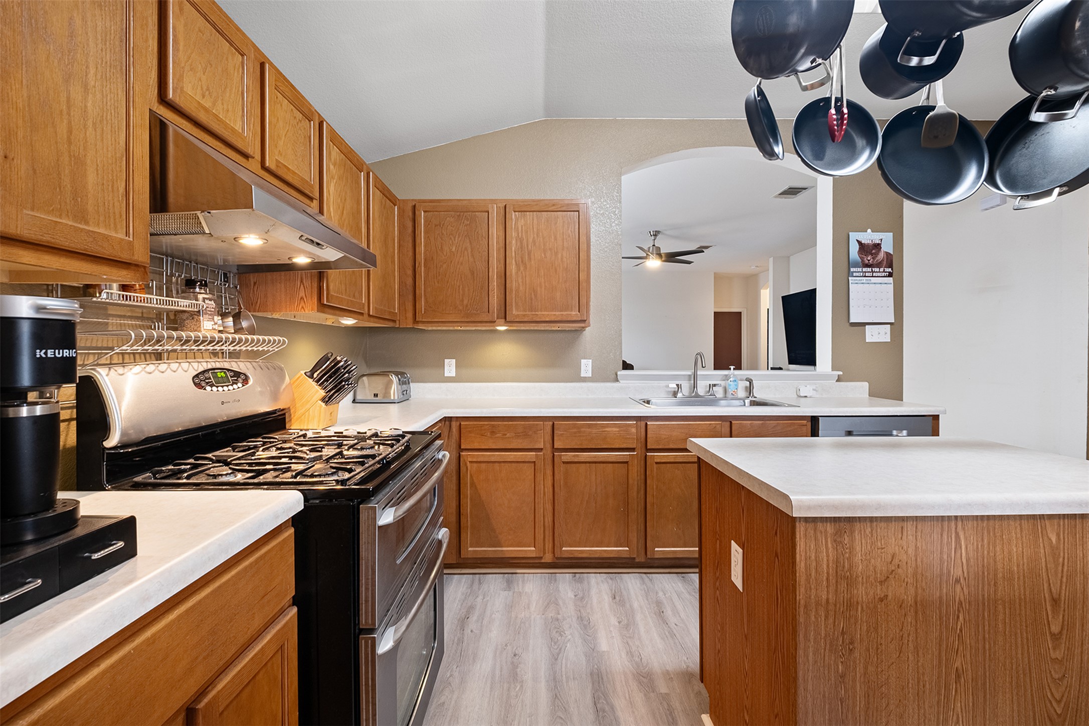 745 Caylor Cove Bastrop, TX 78602 - Photo 15 of 38 a kitchen with stainless steel appliances granite countertop a sink stove and cabinets
