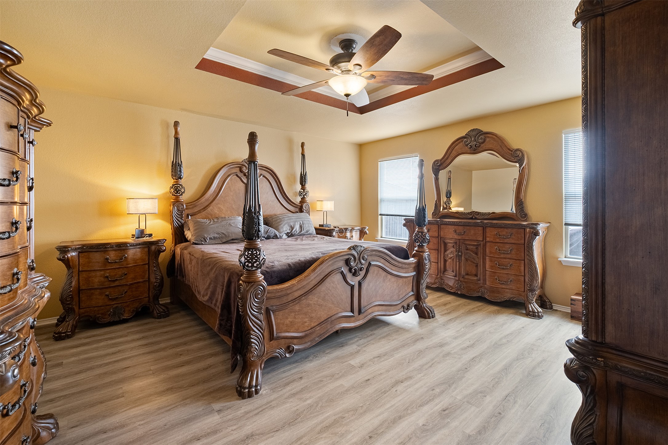 745 Caylor Cove Bastrop, TX 78602 - Photo 20 of 38 a bedroom with a bed and wooden floor