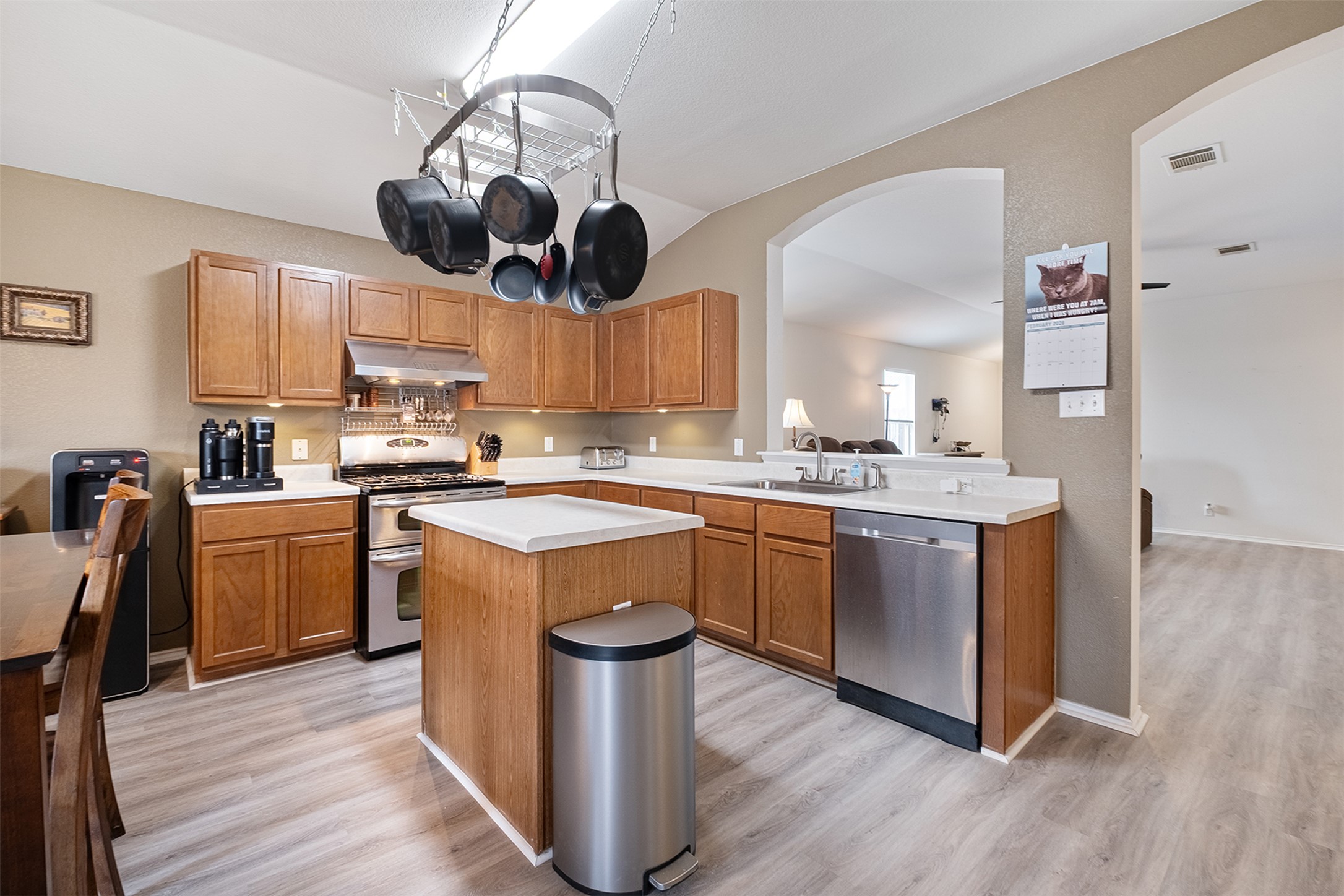 745 Caylor Cove Bastrop, TX 78602 - Photo 5 of 38 a kitchen with a sink a counter space appliances and cabinets