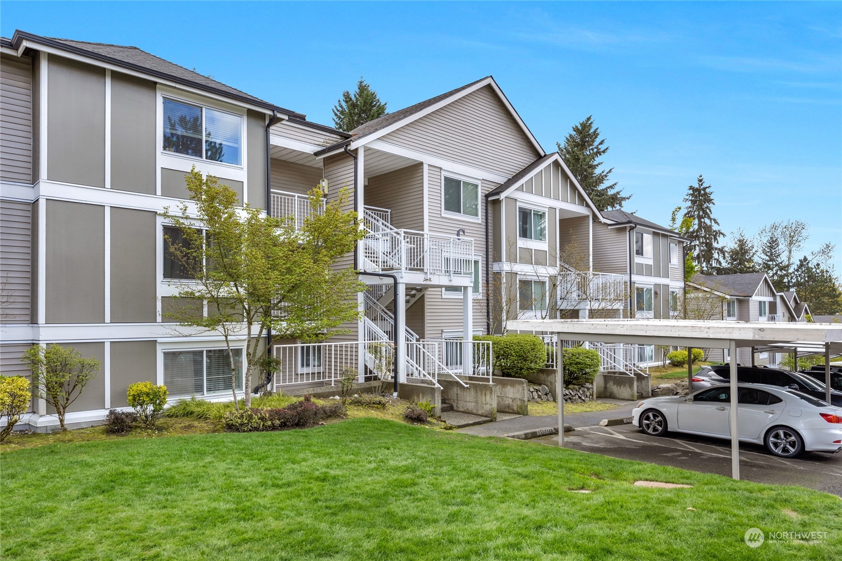 16101 Bothell Everett Highway, Unit C304 Mill Creek, WA 98012 - Photo 1 of 22 a front view of building with yard