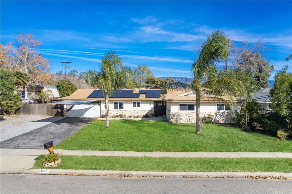 6267 Apple Avenue Rialto, CA 92377 - Photo 1 of 1 a view of a patio with a yard