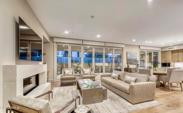 a living room with furniture and fireplace