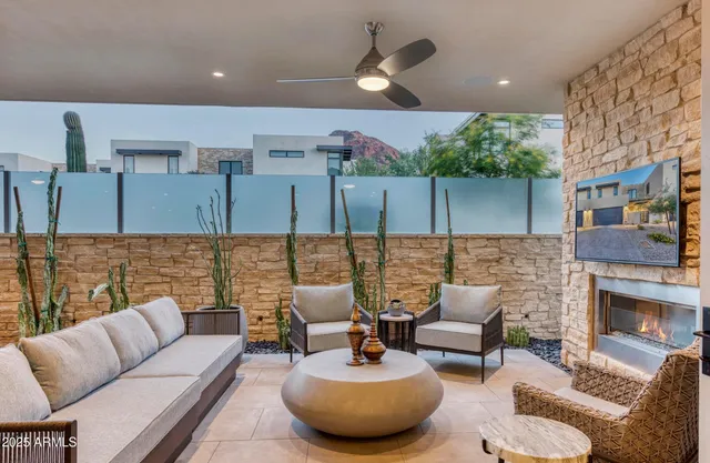 a living room with furniture and a fireplace
