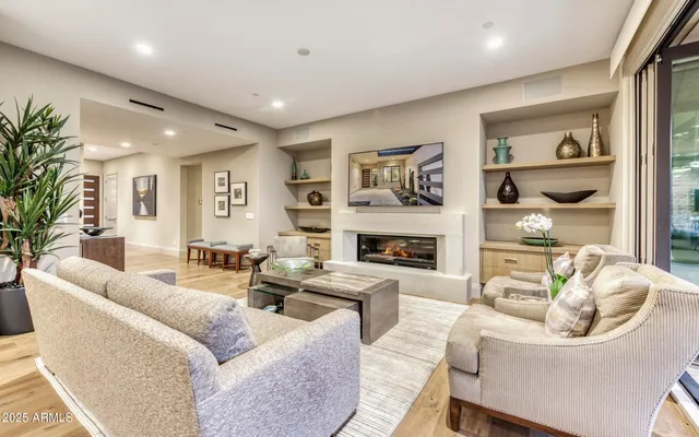 a living room with furniture and a fireplace