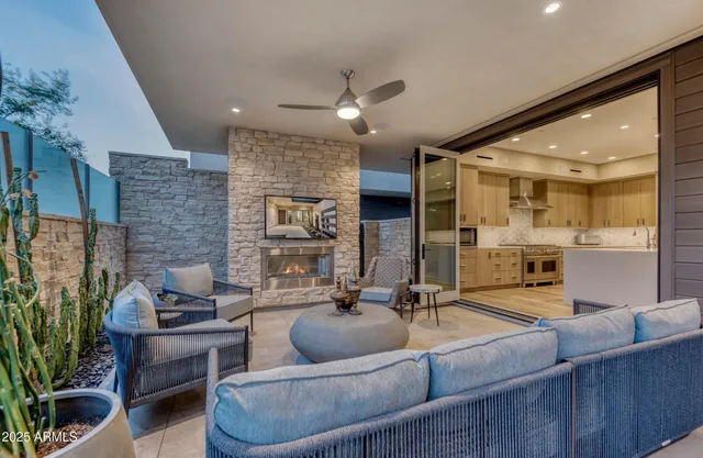 a living room with furniture and a large mirror