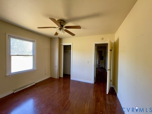 10024 South Hill Road Kenbridge, VA 23944 - Photo 20 of 32 a view of an empty room with wooden floor and a window