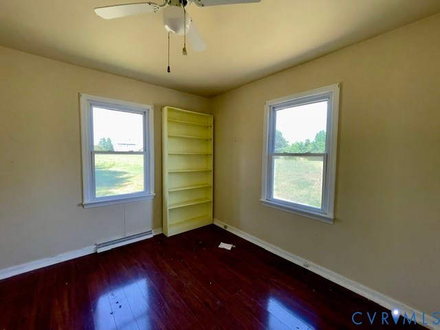 10024 South Hill Road Kenbridge, VA 23944 - Photo 22 of 32 a view of an empty room with wooden floor and a window
