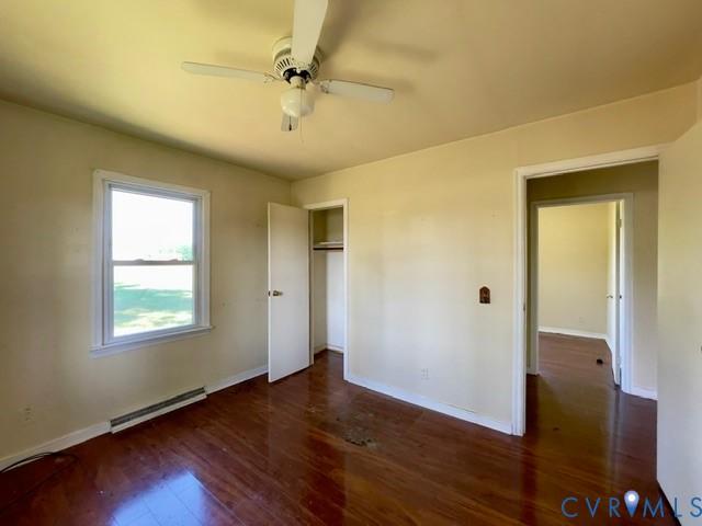 10024 South Hill Road Kenbridge, VA 23944 - Photo 25 of 32 a view of an empty room with wooden floor and a window