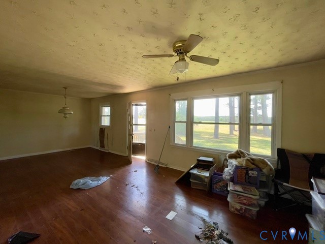 10024 South Hill Road Kenbridge, VA 23944 - Photo 26 of 32 a living room with furniture and floor to ceiling windows