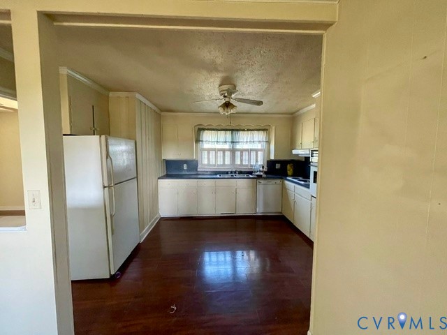 10024 South Hill Road Kenbridge, VA 23944 - Photo 7 of 32 a view of a kitchen with a sink wooden floor and a window