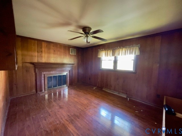 10024 South Hill Road Kenbridge, VA 23944 - Photo 9 of 32 a view of an empty room with a fireplace and a window