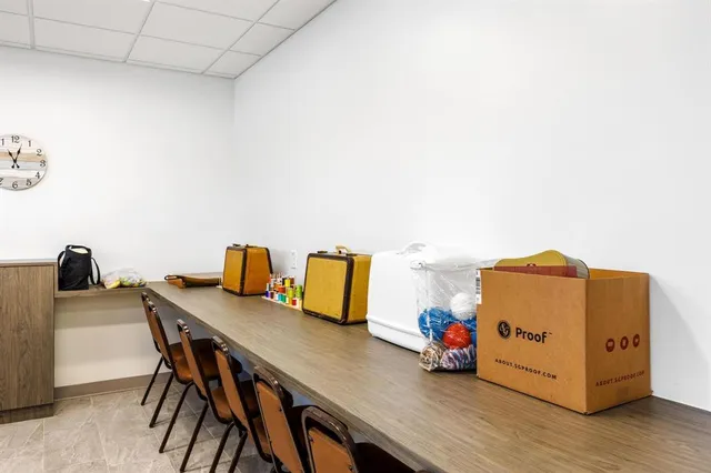 a room with a table and chairs