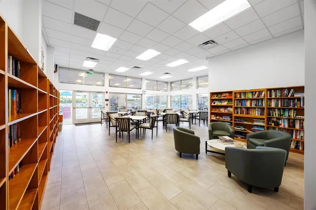 a room with furniture and lots of gym equipment