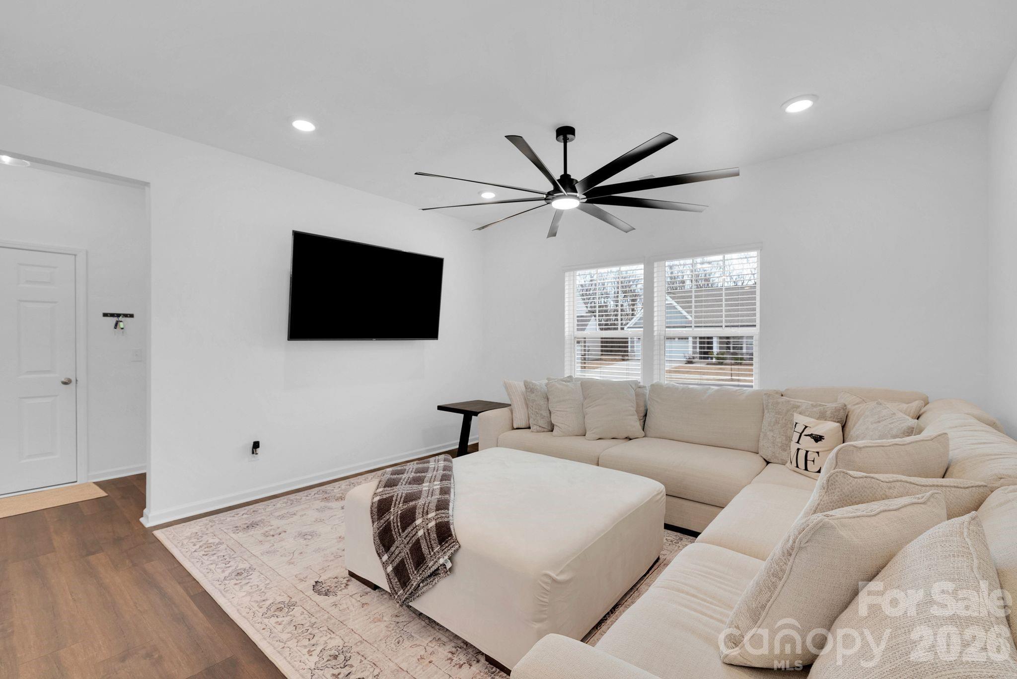 175 Aspire Circle Wingate, NC 28174 - Photo 6 of 24 a living room with furniture and a flat screen tv