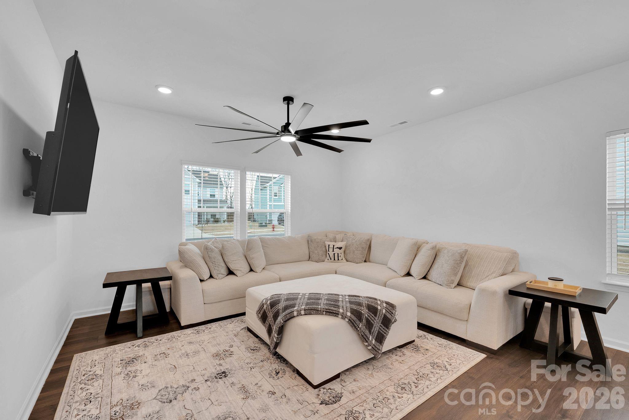175 Aspire Circle Wingate, NC 28174 - Photo 8 of 24 a living room with furniture and a flat screen tv