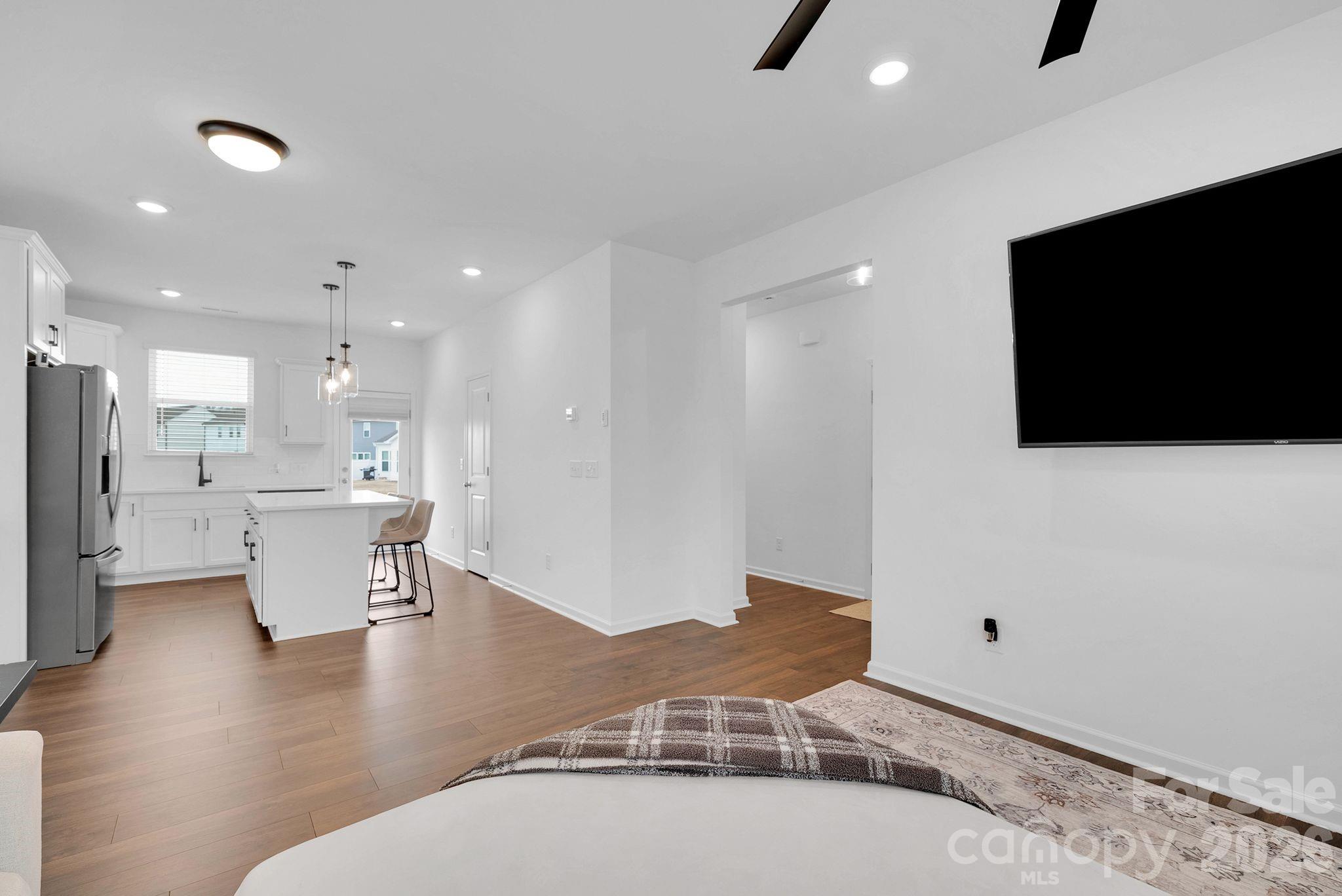 175 Aspire Circle Wingate, NC 28174 - Photo 9 of 24 a living room with furniture and a flat screen tv