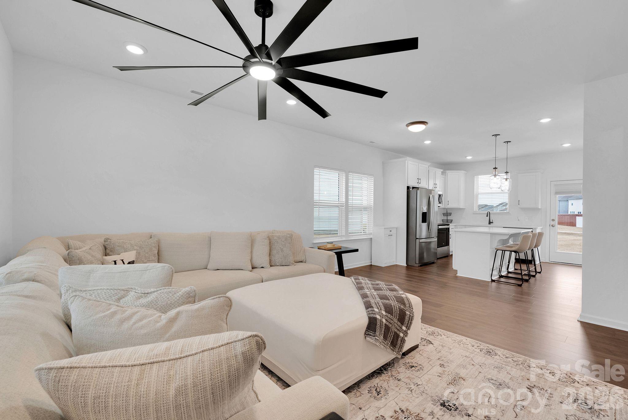 175 Aspire Circle Wingate, NC 28174 - Photo 10 of 24 a living room with furniture and a view of kitchen