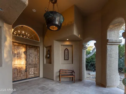 a view of a hallway with a chandelier
