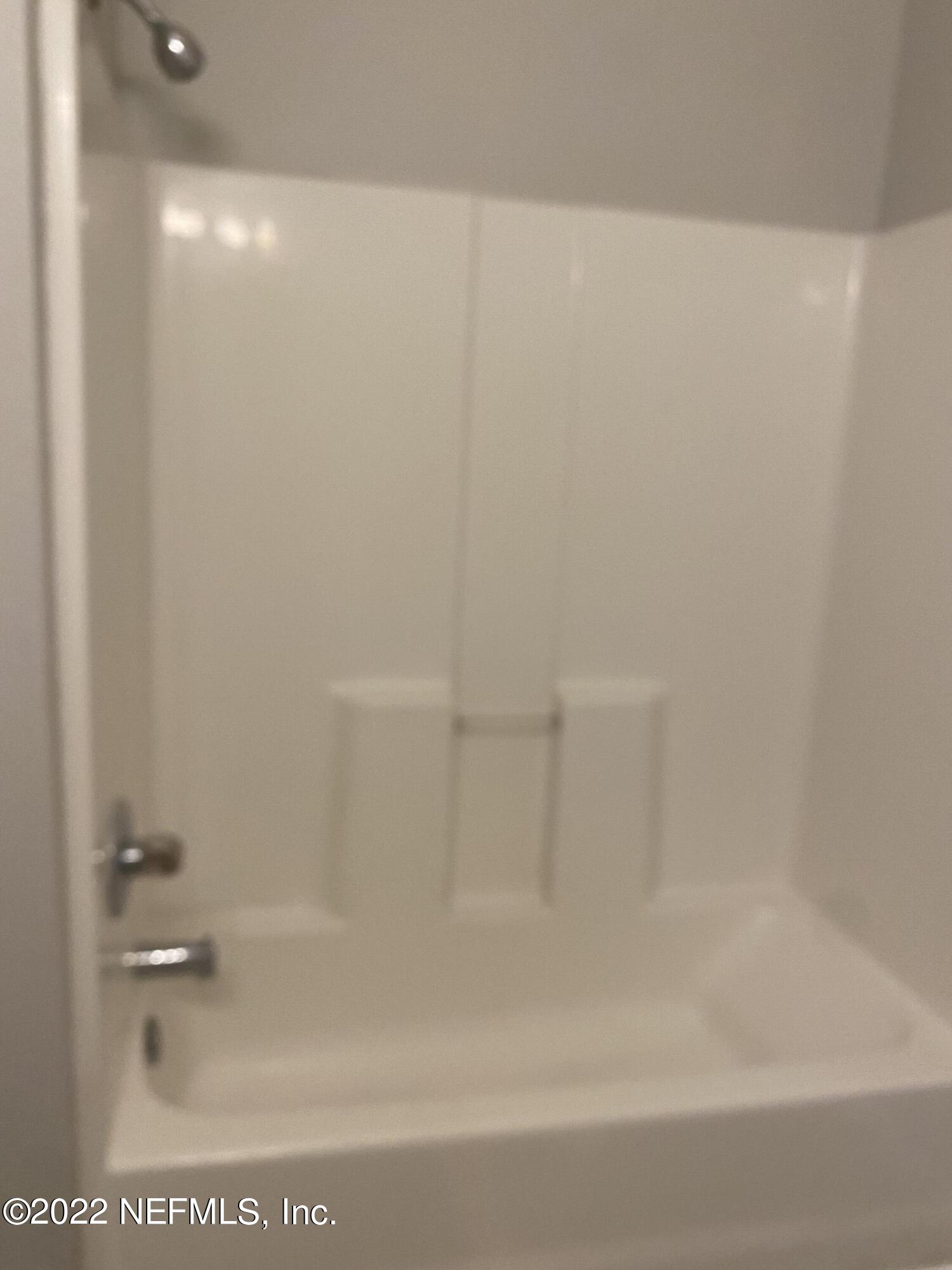 7920 Merrill Road, Unit 101 Jacksonville, FL 32277 - Photo 12 of 14 a close up of a bathtub