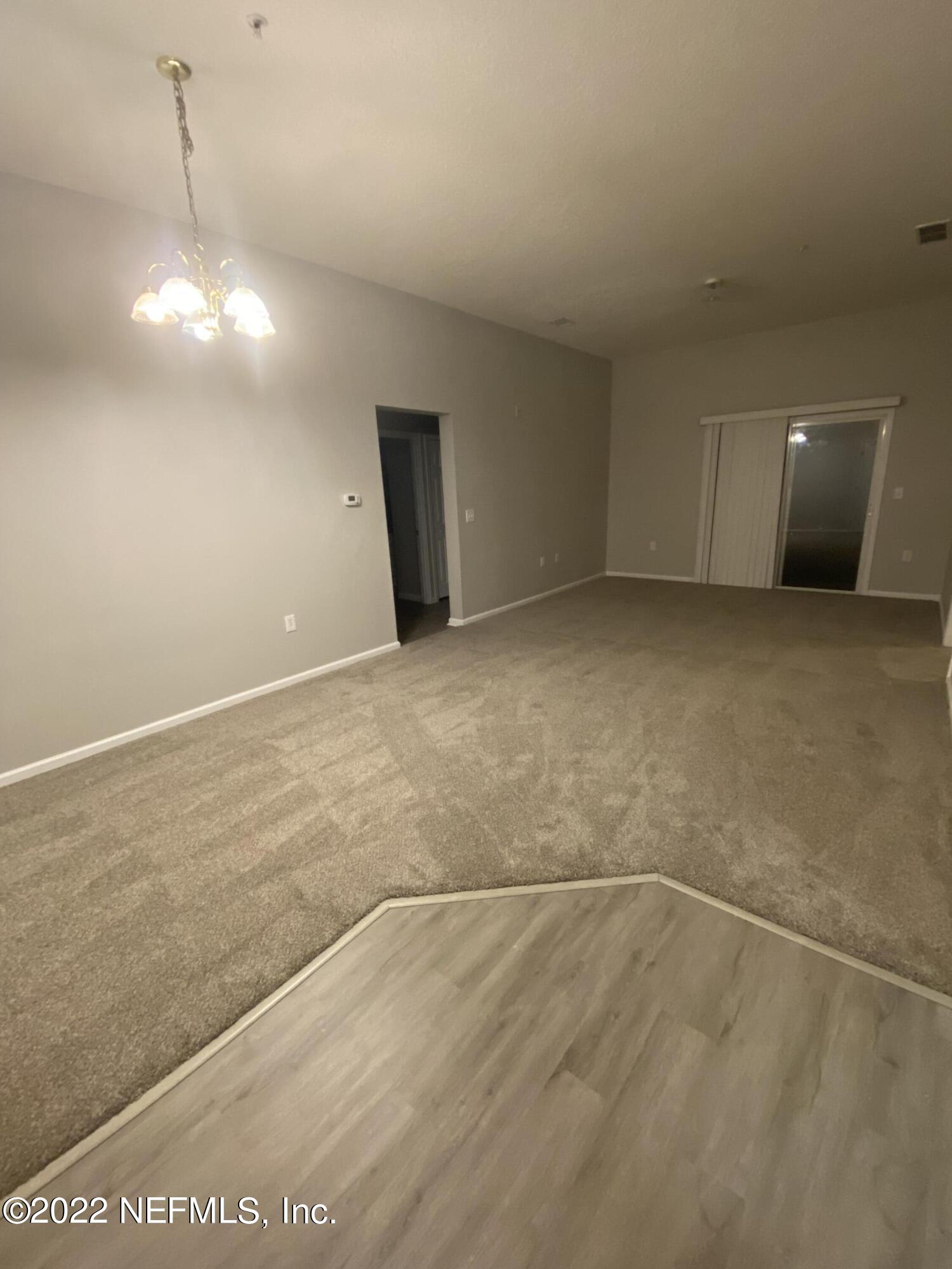 7920 Merrill Road, Unit 101 Jacksonville, FL 32277 - Photo 9 of 14 a view of an empty room with a window