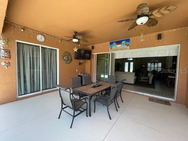a view of a patio with table and chairs