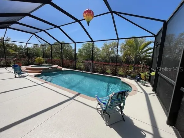 a view of a backyard with sitting area and furniture