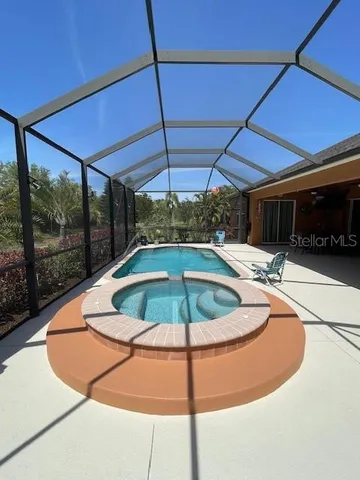 a view of a swimming pool with a porch