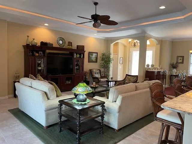 a living room with fireplace furniture and a flat screen tv