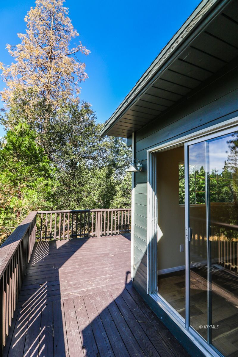 25585 Seneca Road Idyllwild, CA 92549 - Photo 17 of 24 a view of a balcony with wooden floor