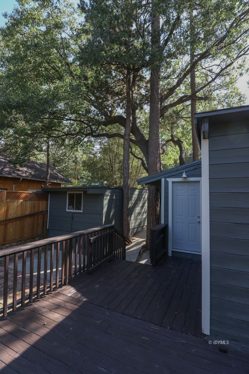 25585 Seneca Road Idyllwild, CA 92549 - Photo 21 of 24 a side view of a house with a bench