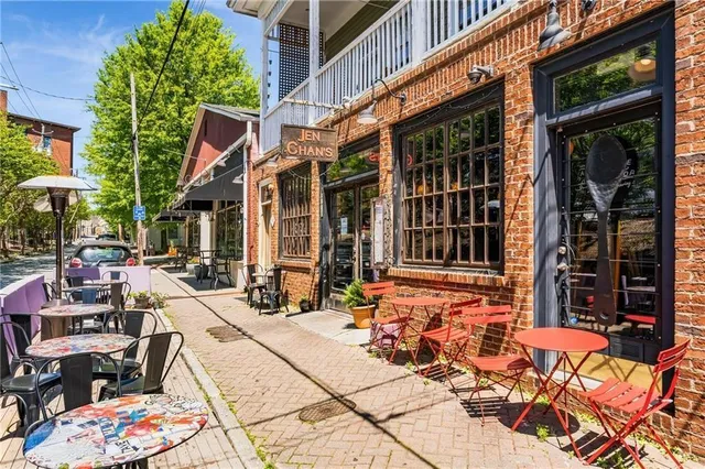 a view of a patio with table and chairs and potted plants