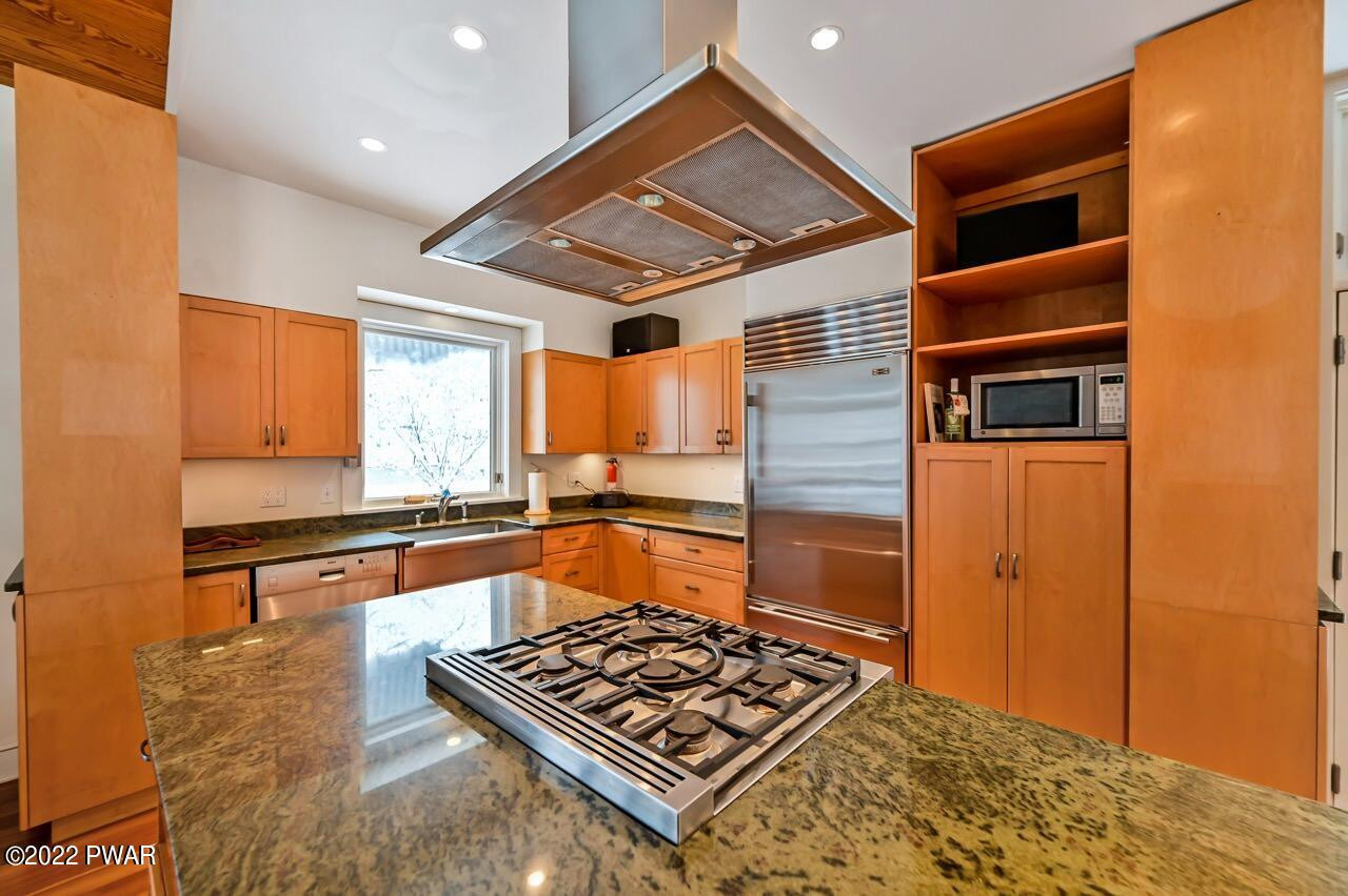 45 Tammany Flats Road Damascus, PA 18415 - Photo 33 of 73 a kitchen with stainless steel appliances granite countertop a stove and a refrigerator