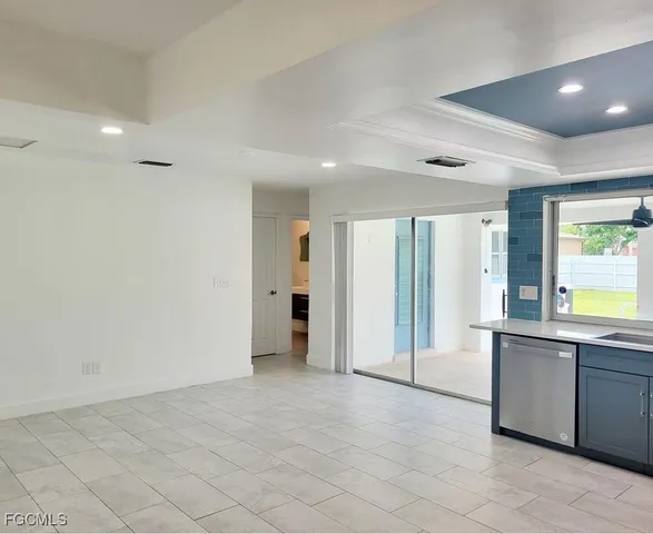 a view of a kitchen with a sink and cabinets
