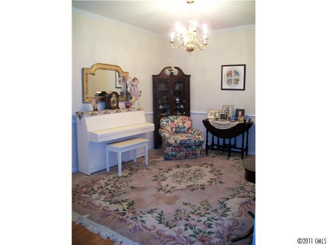 1671 Onyx Ridge, Unit 1671 Fort Mill, SC 29708 - Photo 2 of 15 a living room with furniture and a dining table