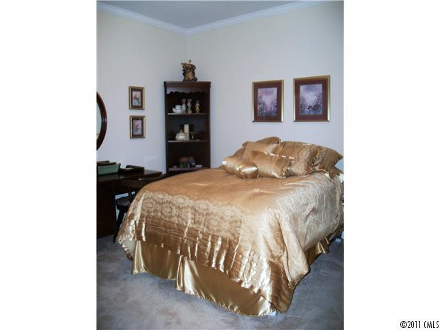 1671 Onyx Ridge, Unit 1671 Fort Mill, SC 29708 - Photo 12 of 15 a bedroom with a bed and a window