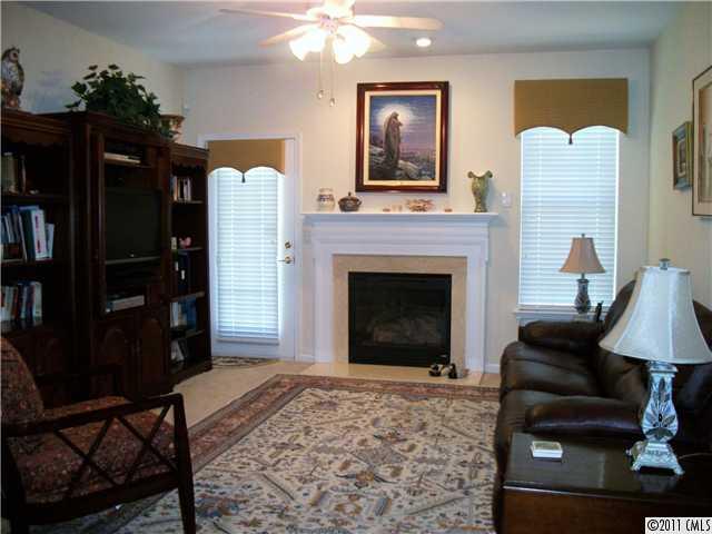 1671 Onyx Ridge, Unit 1671 Fort Mill, SC 29708 - Photo 3 of 15 a living room with furniture and a fireplace