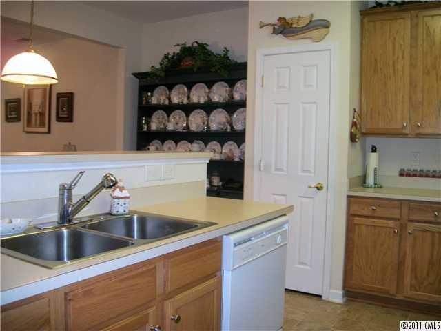 1671 Onyx Ridge, Unit 1671 Fort Mill, SC 29708 - Photo 7 of 15 a kitchen with a sink and cabinets