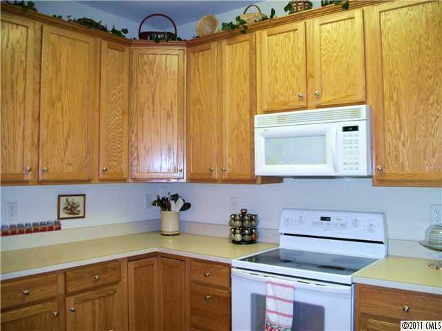 1671 Onyx Ridge, Unit 1671 Fort Mill, SC 29708 - Photo 8 of 15 a kitchen with a sink cabinets and appliances