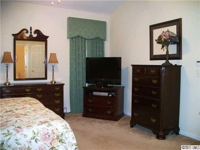 1671 Onyx Ridge, Unit 1671 Fort Mill, SC 29708 - Photo 10 of 15 a bedroom with a bed and a television