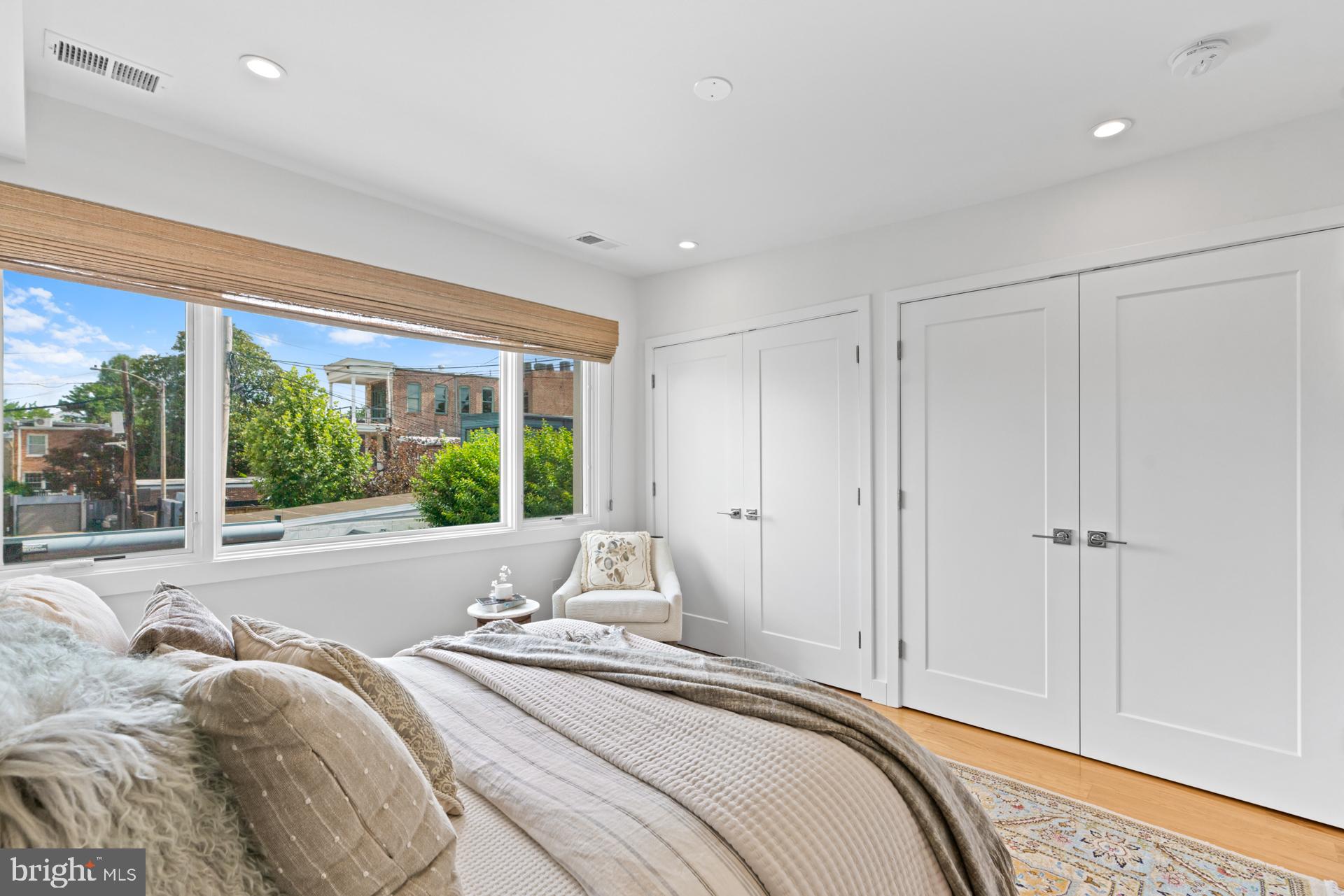 320 A Street Northeast Washington, DC 20002 - Photo 13 of 36 a spacious bedroom with a bed and a large window