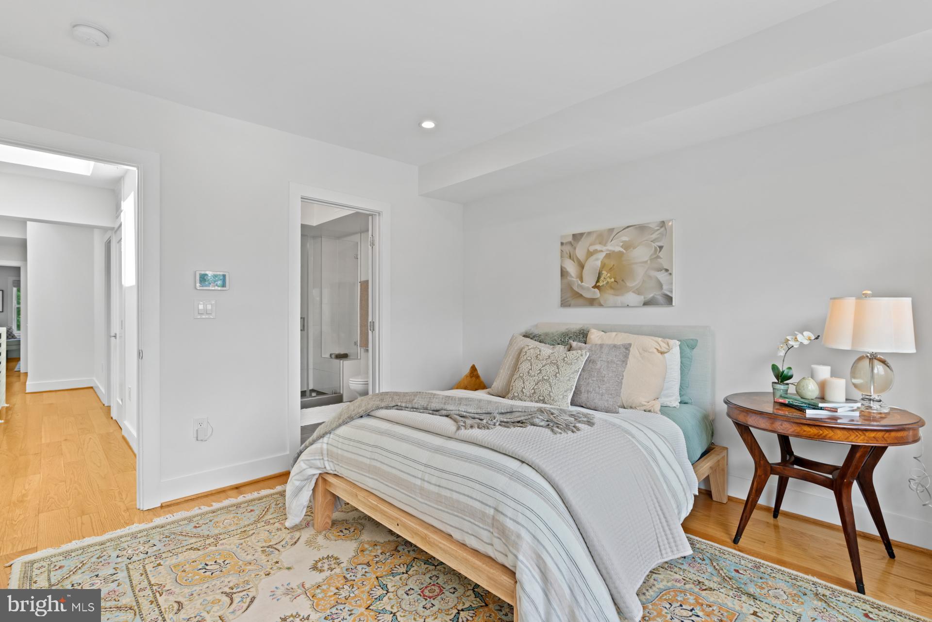 320 A Street Northeast Washington, DC 20002 - Photo 14 of 36 a bedroom with a bed and a table in it